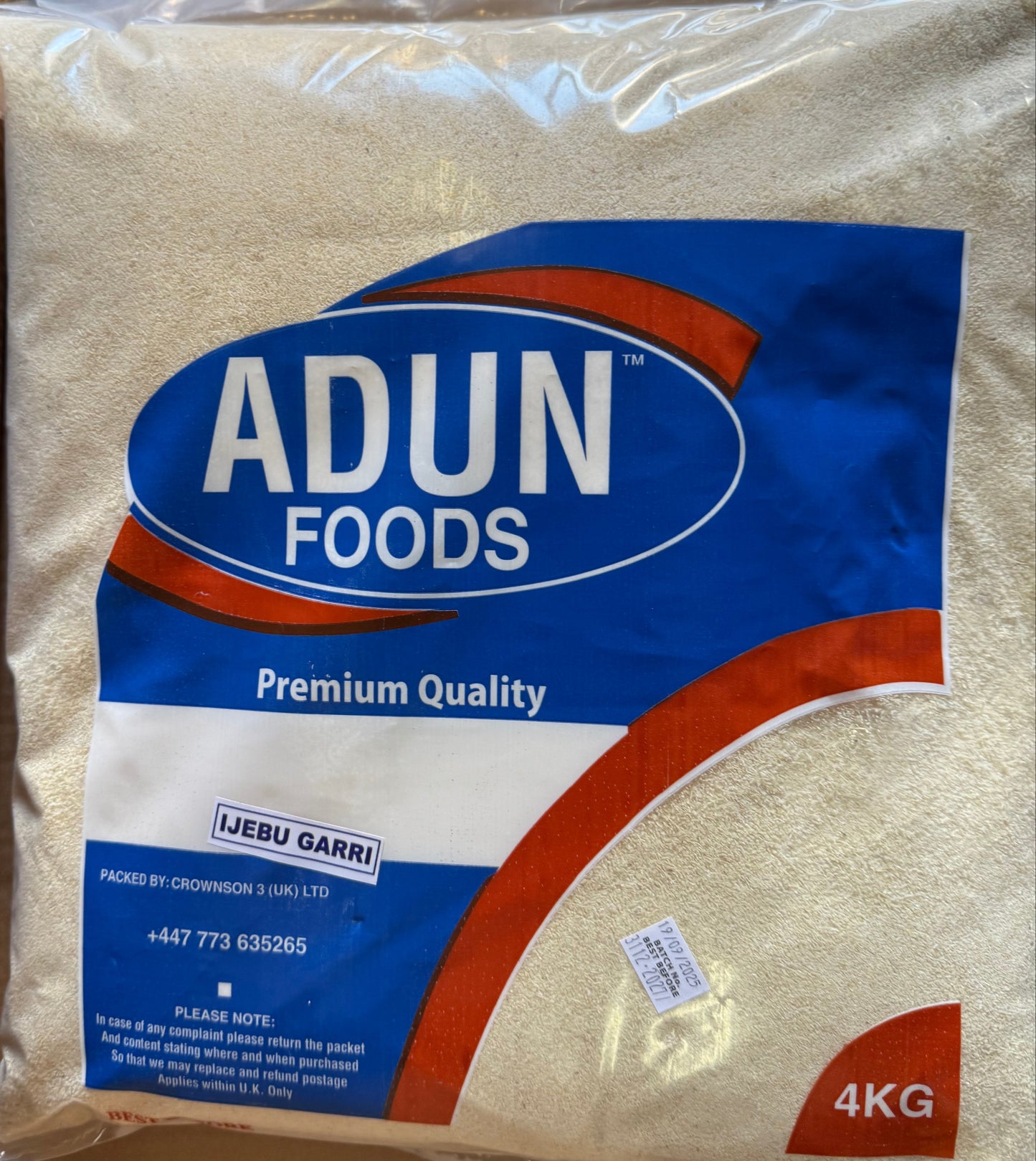Adun Foods 4KG package on a cardboard box with plastic wrap in the background