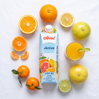 Chivita Active Citrus Mix flat lay surrounded by six citrus fruits