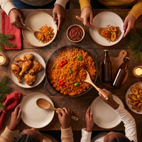 Overhead pot of Nigerian jollof rice with fried chicken and fried plantain at Christmas dinner