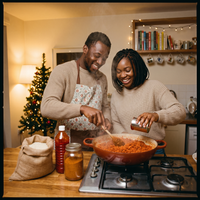 Young couple cooking Nigerian jollof rice together at Christmas in a UK flat